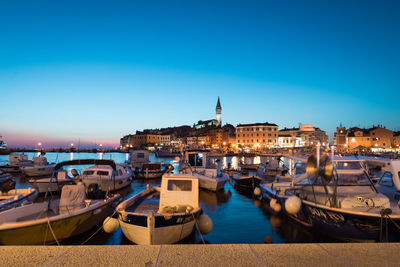 Boats moored at harbor