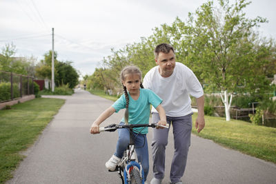 Father and son riding bicycle