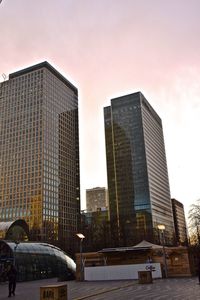 Low angle view of buildings against sky during sunset