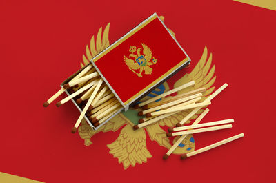 High angle view of traditional windmill against red background