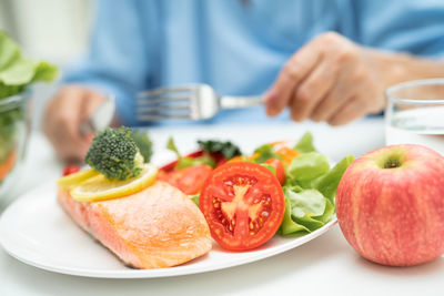 Midsection of man holding food