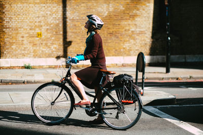 Man riding bicycle on street