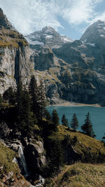 Scenic view of lake and mountains against sky