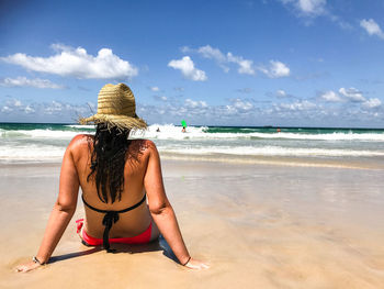 Rear view of woman on beach