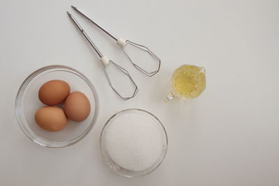 High angle view of eggs in glass on table