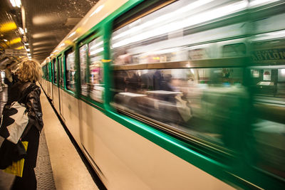 Blurred motion of train at railroad station