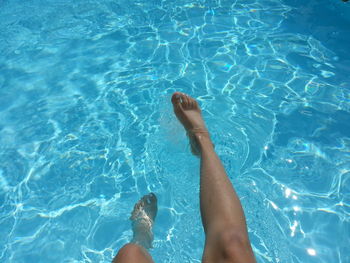 Low section of people in swimming pool