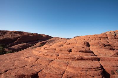 Landscape of red step rock formations in snow canyon state park in utah