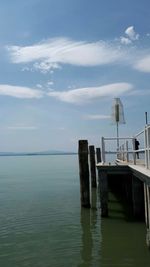 Pier over sea against sky