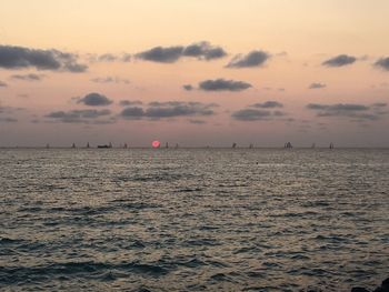 Scenic view of sea against sky at sunset