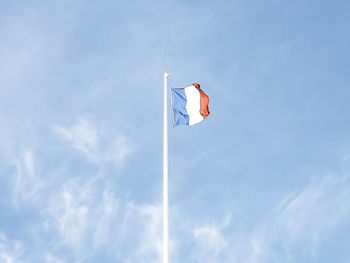 Low angle view of flag against sky