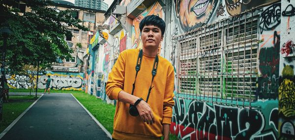 Portrait of young man standing outdoors