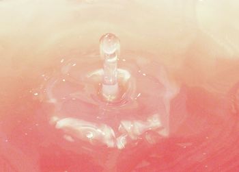 Close-up of water splashing in glass