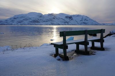 Scenic view of frozen lake against mountain range