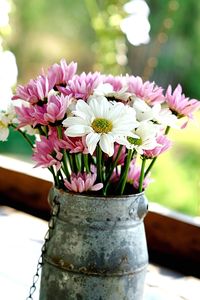 Close-up of pink flower pot on table