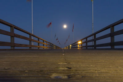 Illuminated suspension bridge at night