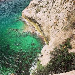 High angle view of rock formation in sea