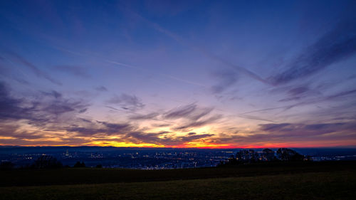 Scenic view of sunset over city