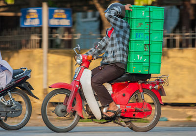 Man riding bicycle on street