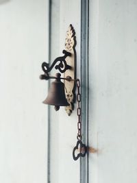 Close-up of bell mounted on door