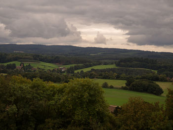 Scenic view of agricultural landscape against sky