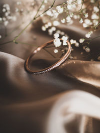 Close-up of wedding rings on table