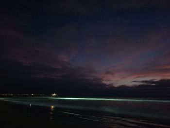 Scenic view of sea against sky at night