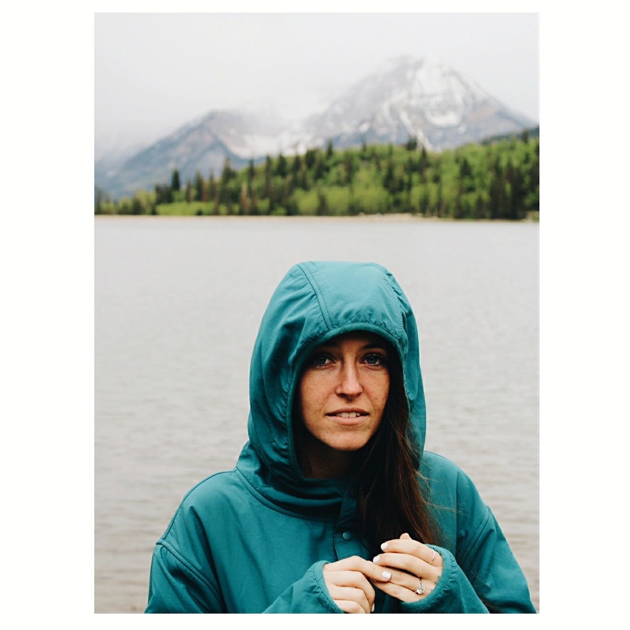 portrait, mountain, one person, water, hood, real people, transfer print, headshot, hood - clothing, lifestyles, lake, auto post production filter, leisure activity, hooded shirt, mountain range, day, front view, clothing, outdoors