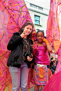 Full length of a smiling girl standing outdoors