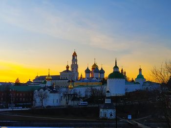 Buildings against sky during sunset