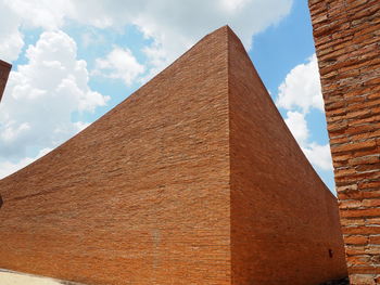 Low angle view of historical building against cloudy sky