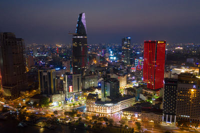 High angle view of illuminated city buildings at night