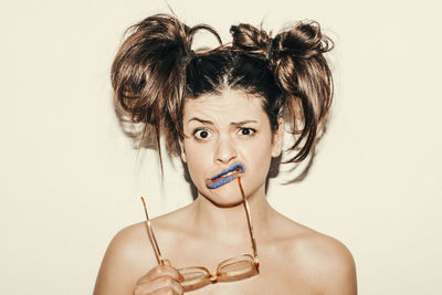 Portrait of a beautiful young woman over white background