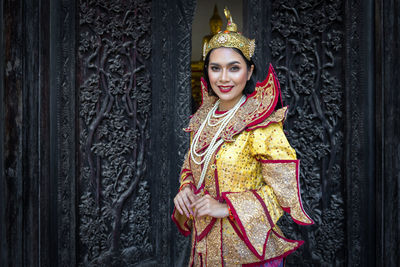 Smiling young woman in temple