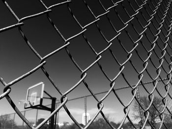 Close-up of chainlink fence against clear sky