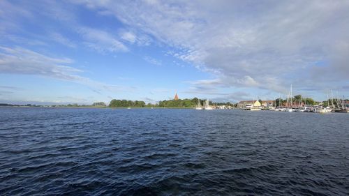 Scenic view of sea against blue sky