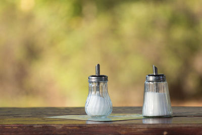 Sugar dispenser on a bistro table outdoors