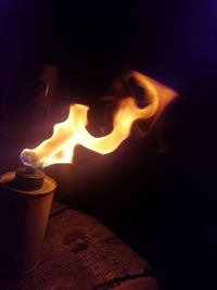 Close-up of fire burning in the dark