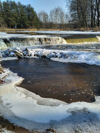 Scenic view of frozen stream