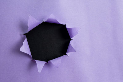 Close-up of purple paper against white background
