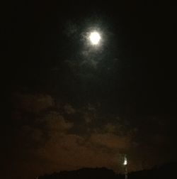 Low angle view of moon in sky at night