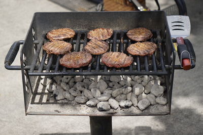 High angle view of food and coal in barbecue