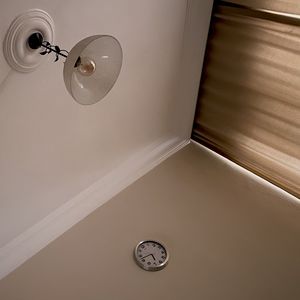 Low angle view of clock on ceiling at home