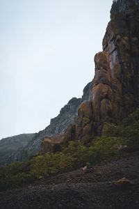 Low angle view of rock formation against clear sky