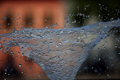 Close-up of wet glass window during rainy season