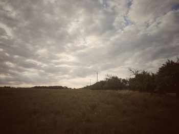 Scenic view of landscape against cloudy sky