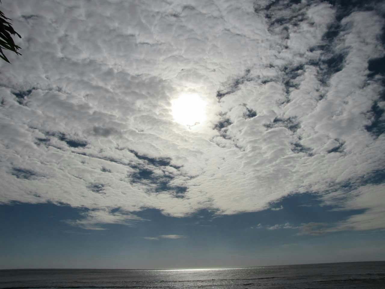 sea, water, horizon over water, scenics, tranquil scene, tranquility, sky, beauty in nature, nature, sun, cloud - sky, idyllic, waterfront, beach, reflection, cloudy, sunset, sunlight, cloud, outdoors