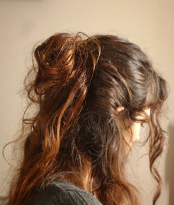 Portrait of woman with hair against white background