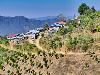 High angle view of trees and buildings against sky