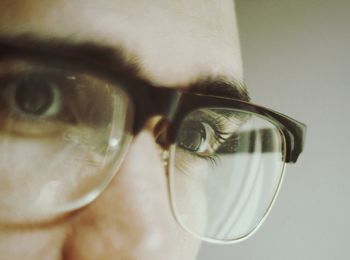 Close-up of man wearing eyeglasses